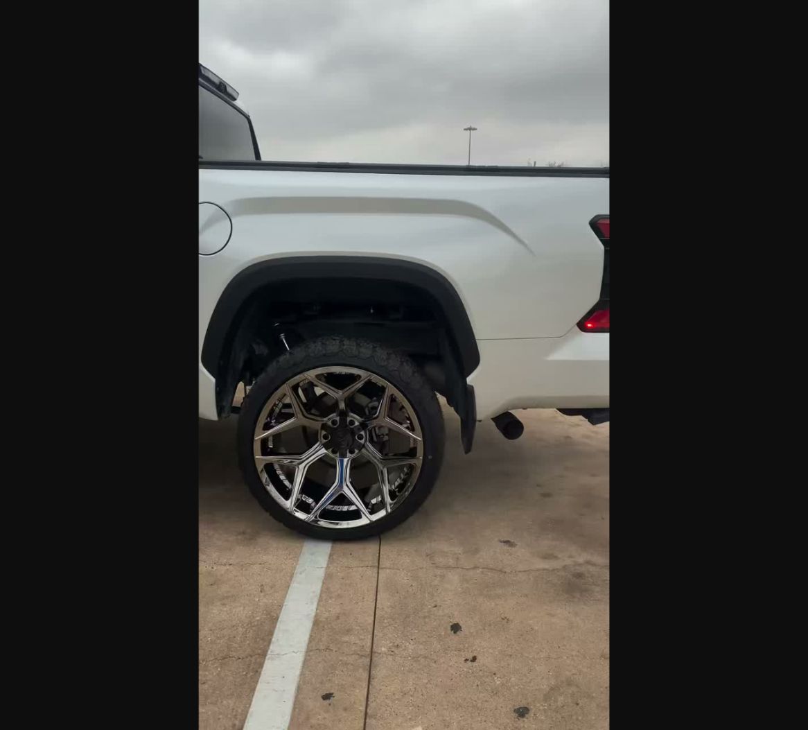 White truck with custom wheel and tire fitment from Wayside Customz Houston